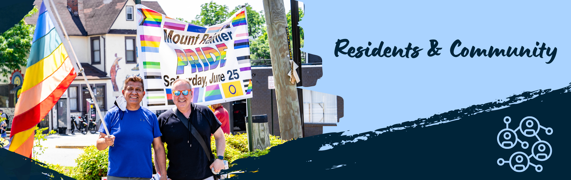 Two residents with a rainbow flag stand near a banner: Mount Rainier Pride Day. Saturday June 25.